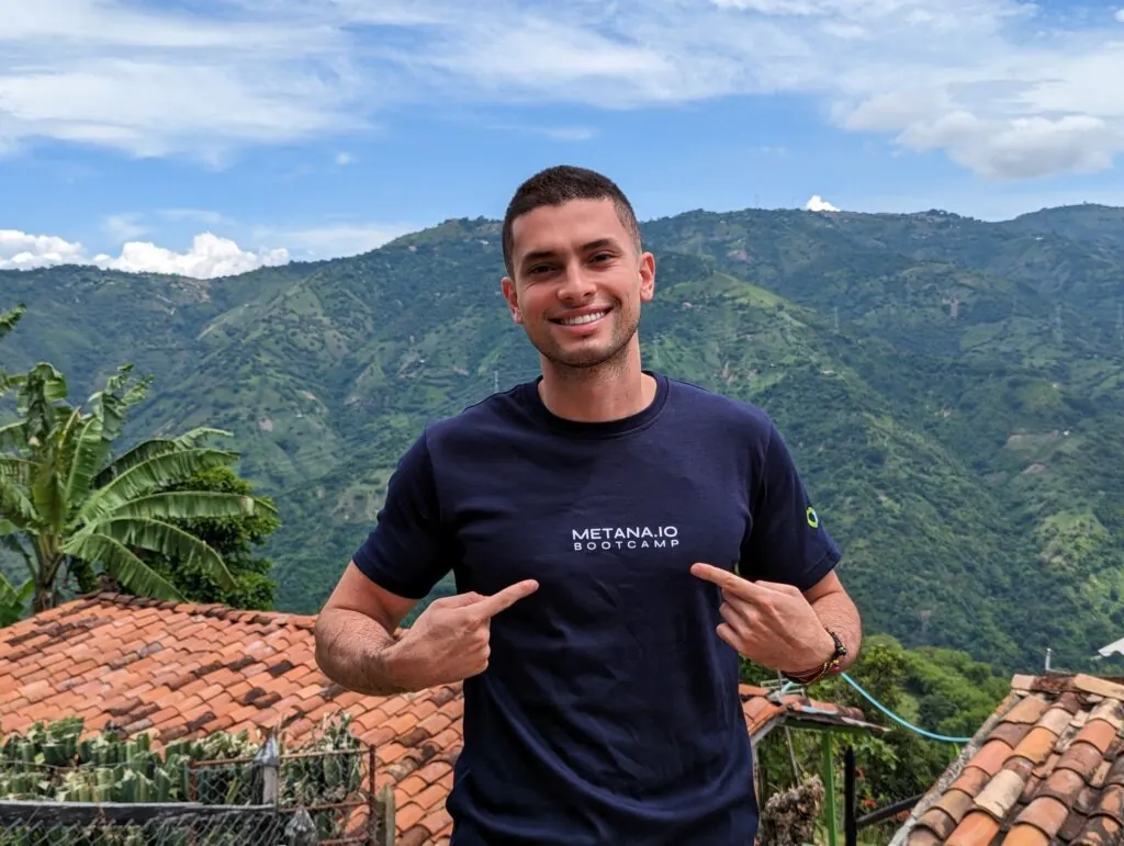 Metana graduate celebrating outdoors in Metana bootcamp gear